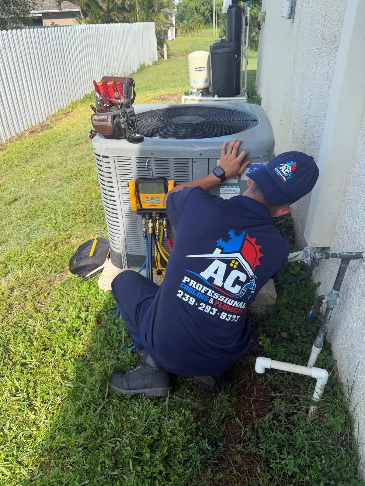 AC Professional technician working on an outdoor AC unit during a repair visit