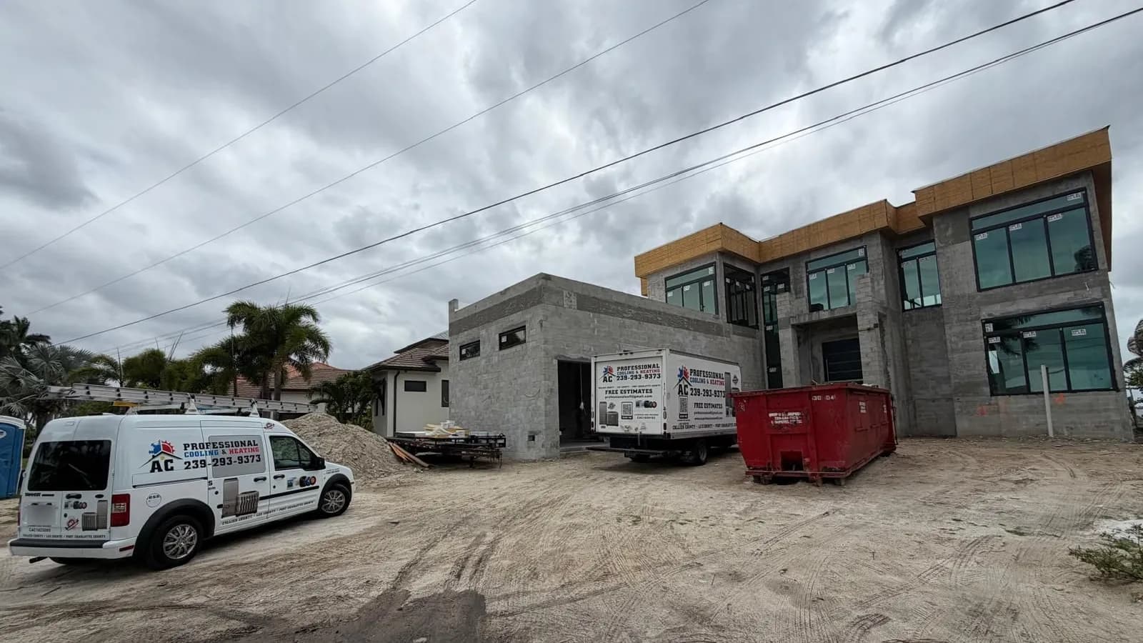 New construction HVAC by AC Professional Cooling & Heating: service van and truck at a home under construction in Southwest Florida